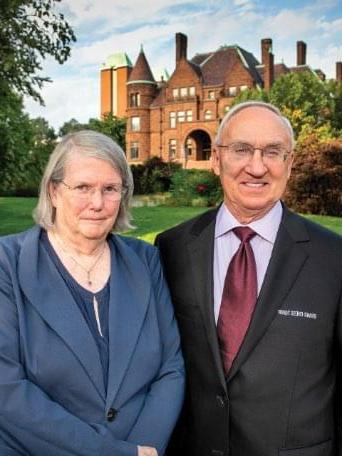 Pictured: Dr. Jeanne and Rex Sinquefield pose for a photograph in front of the historic Samuel Cupples House on the campus of Saint Louis University